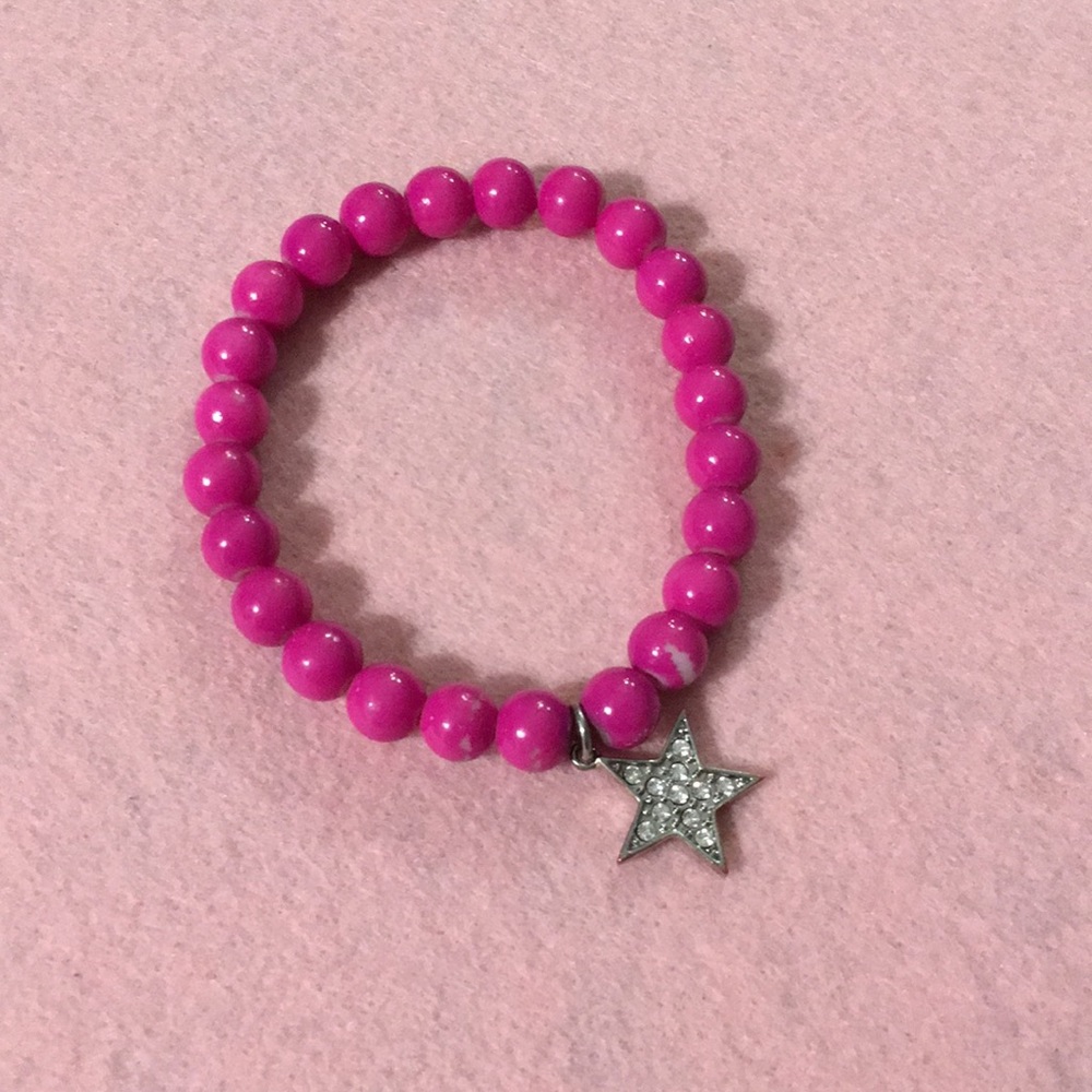 Beautiful dark pink bracelet with a shining star